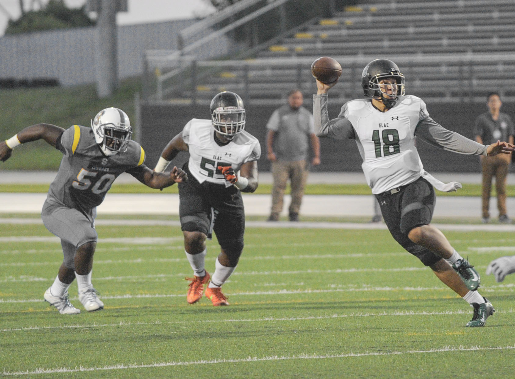 Huskies quarterback Phillip Tran attempts a pass during East Los Angeles College's first touchdown drive in a 71-13 win at LA Southwest College. (Photo by Tadzio Garcia)