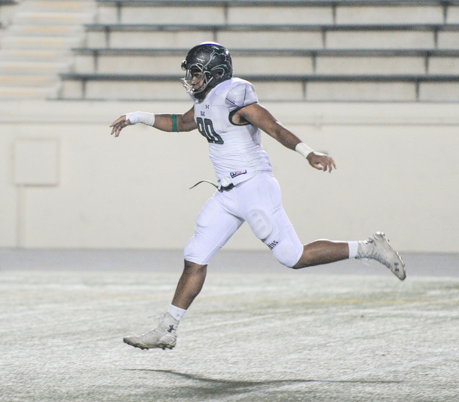 Sophomore defensive lineman Sione Vea is air bound trying to block a punt in a 49-7 win against ECC Compton. (Photo by Tadzio Garcia)