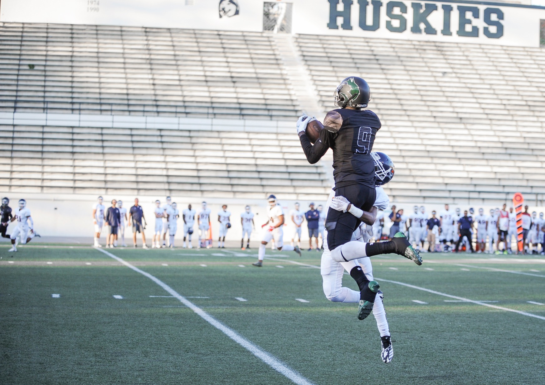East Los Angeles College sophomore Terrell Robinson is air-bound to try and haul in a long pass in a 25-14 win vs. Orange Coast College at Weingart Stadium on Sept. 8, 2018 (Photo by Tadzio Garcia)