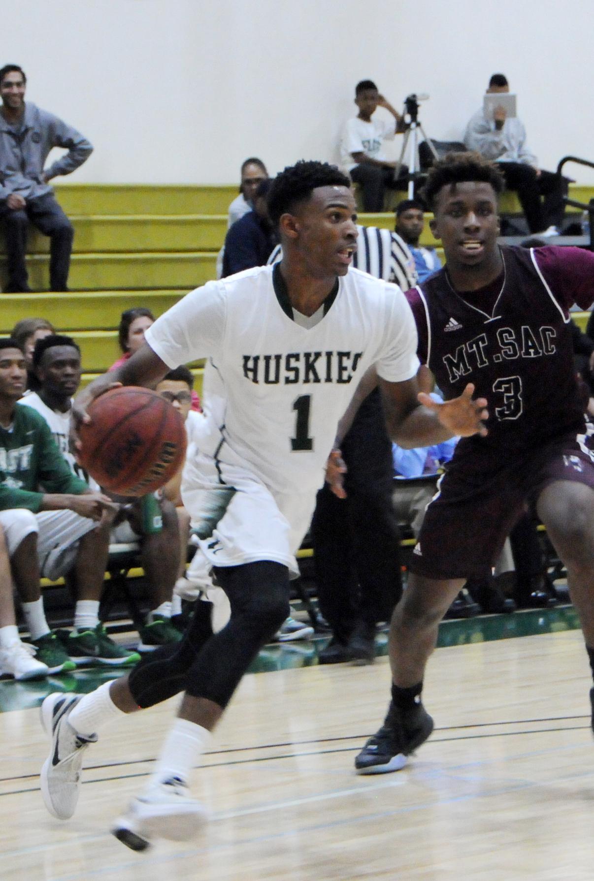 DRIVING SWEENY&mdash;East Los Angeles College sophomore guard Iziahiah Sweeny drives towards the paint around Mt. San Antonio College freshman guard Marquis Reed in an 82-62 Husky win at home on Jan. 23, 2015. (Photo by DeeDee Jackson)