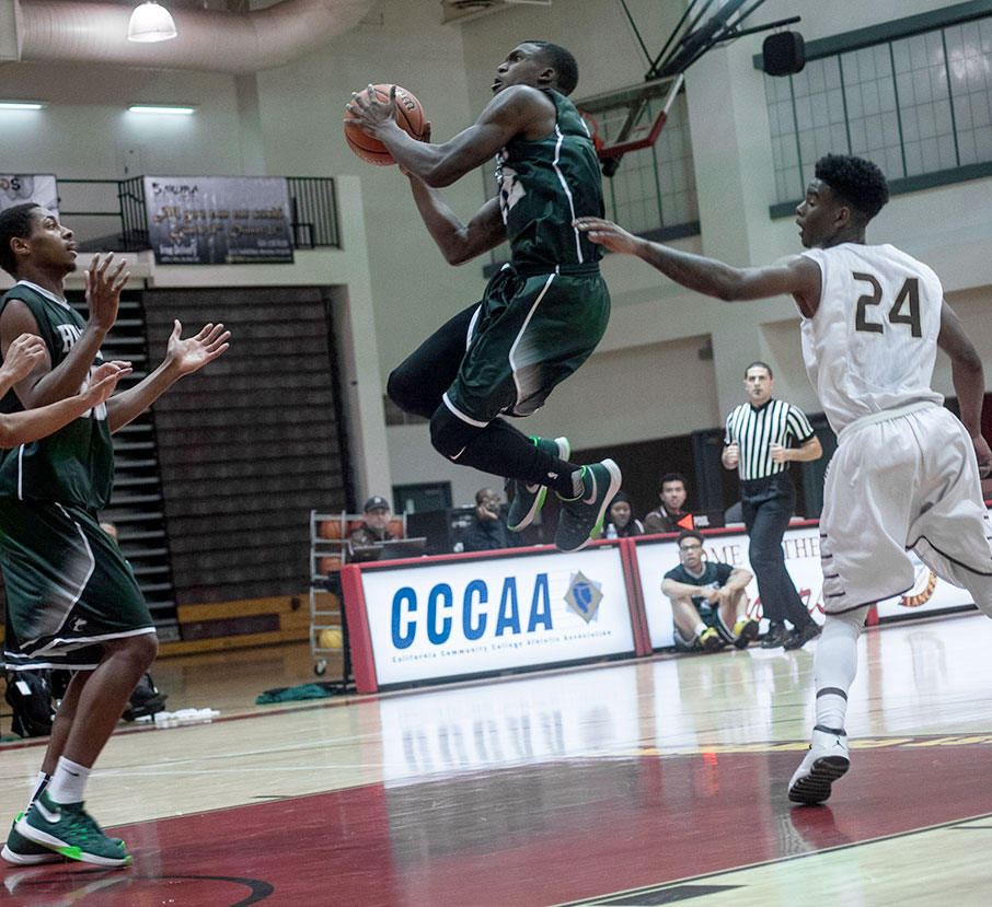 East Los Angeles sophomore guard Jarrell Tate takes to flight to attempt a jump shot in a 70-51 win at Pasadena City College on Jan. 27. (Photo by Tadzio Garcia)