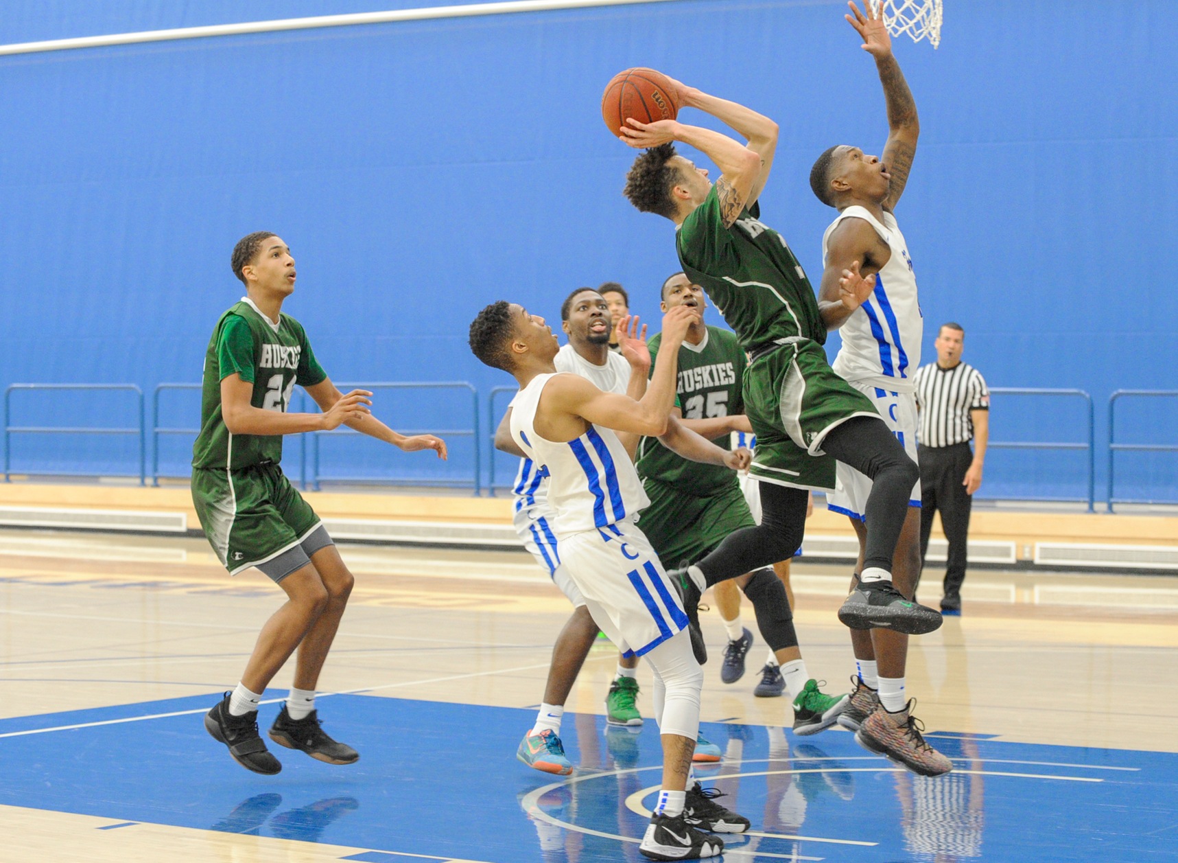 East Los Angeles College guard Deshaun Highler attempts a jump shot in the paint in a 71-62 Huskies loss to Cerritos College, Friday, Dec. 21 at the Aviary. (Photo by Tadzio Garcia)