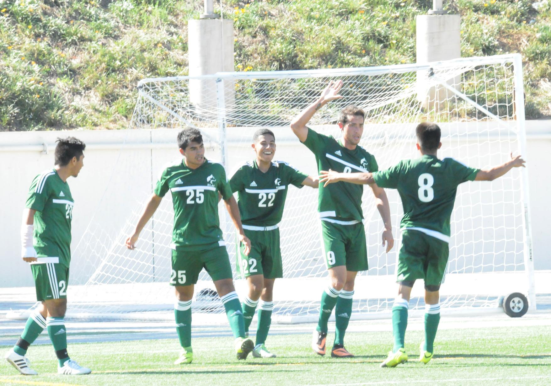 Huskies celebrate a 2-2 tie vs. Santa Ana College. From left, Valentin Mercado, Andres Martinez, Martin Oregel, Cesar Alvarez and Jorge Chavez. (Photo by DeeDee Jackson)