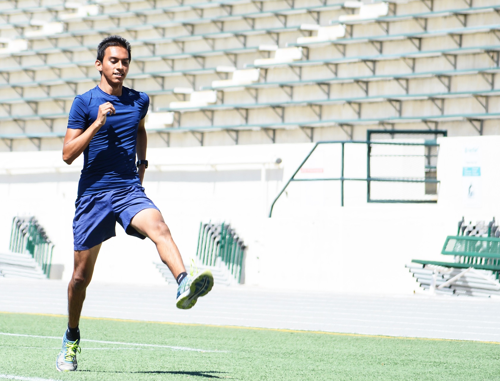 East Los Angeles College T&F sophomore long distance runner Nathan Rangel, warms up last year as a then freshman on the team. He leads the Huskies in the 5,000 and 1,500-meter runs this year. (Photo by Tadzio Garcia)