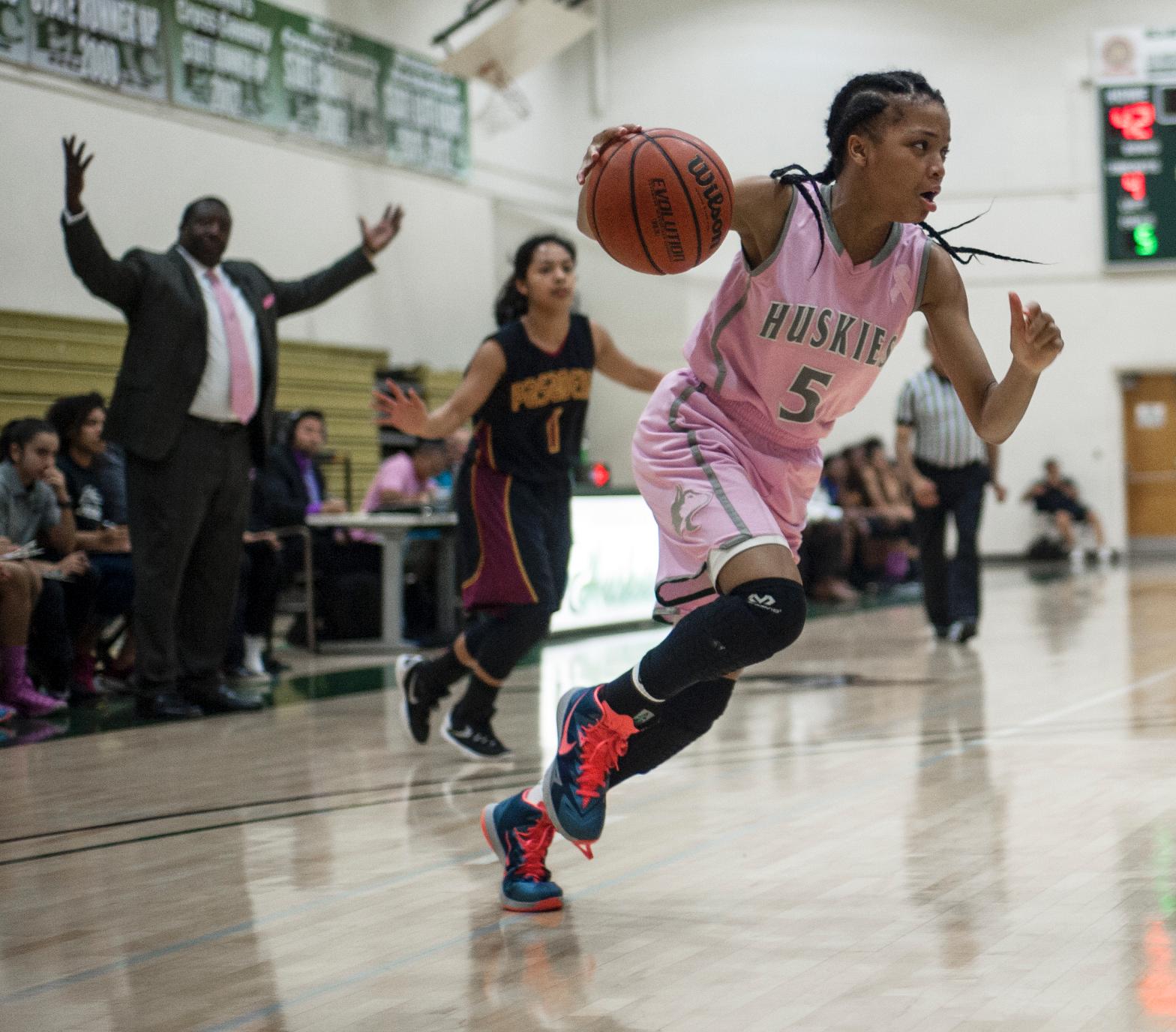 COMING AROUND THE CORNER&mdash;East Los Angeles College women's basketball freshman guard Brianne Cheatum drives towards the paint in a 77-53 loss to Pasadena City College on Feb. 12. (Photo by Tadzio Garcia)